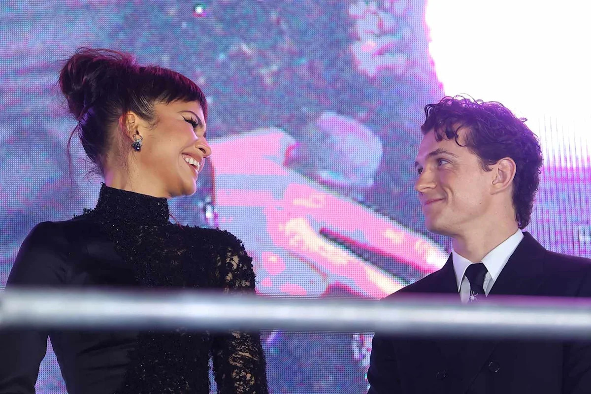 Tom Holland and Zendaya Give Each Other Adorable Air Kisses in Candid “Spider-Man” Red Carpet Moment