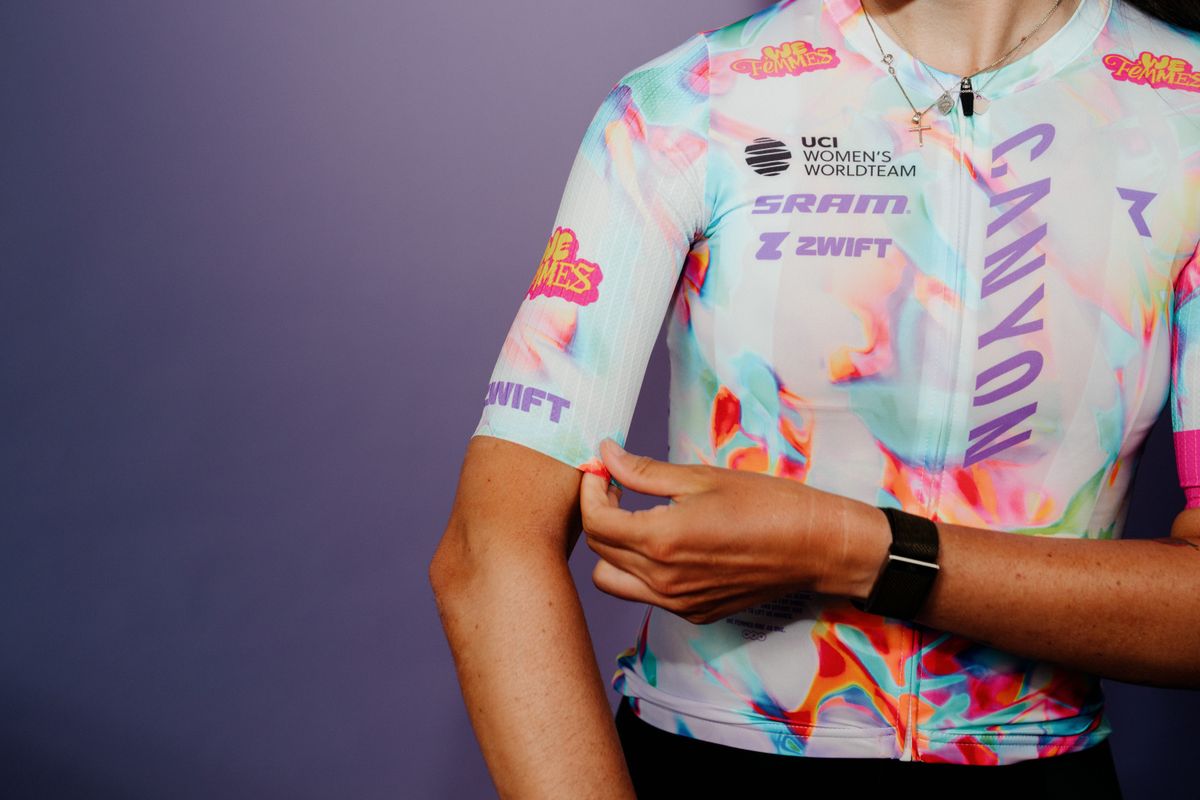 New Canyon-SRAM kit, featuring a light white background with colorful accents of pink, blue, orange and green, plus a pink and yellow 'We Femmes' logo