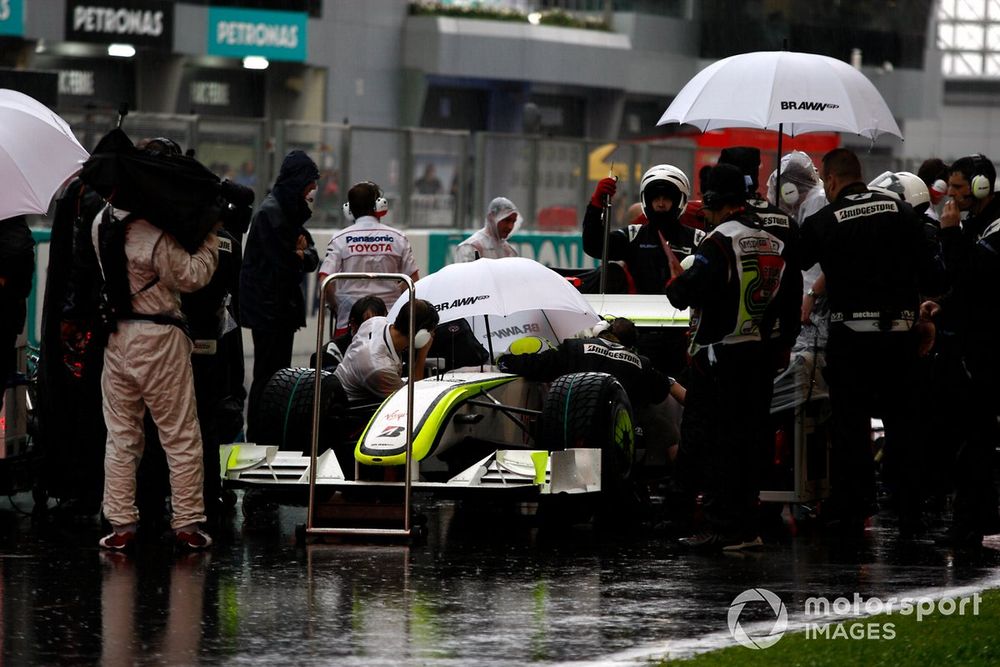 Jenson Button, Brawn GP BGP001 Mercedes sits on the grid after the race was stopped