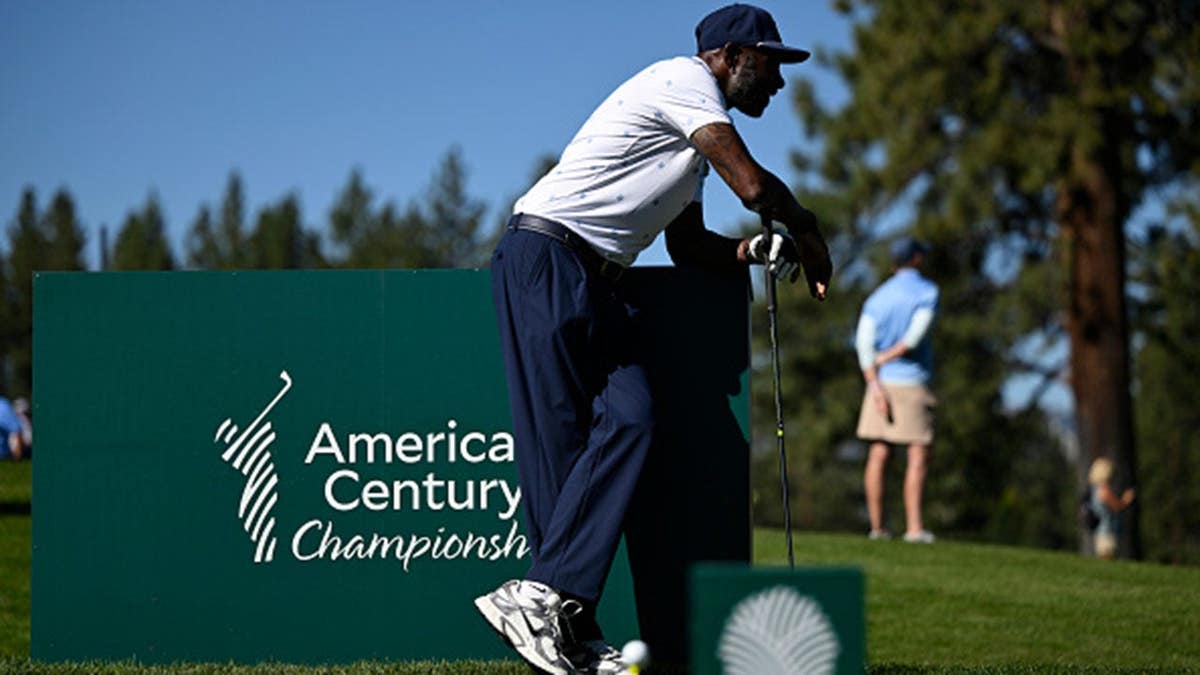 Jerry Rice stands in the third tee box at a golf course.