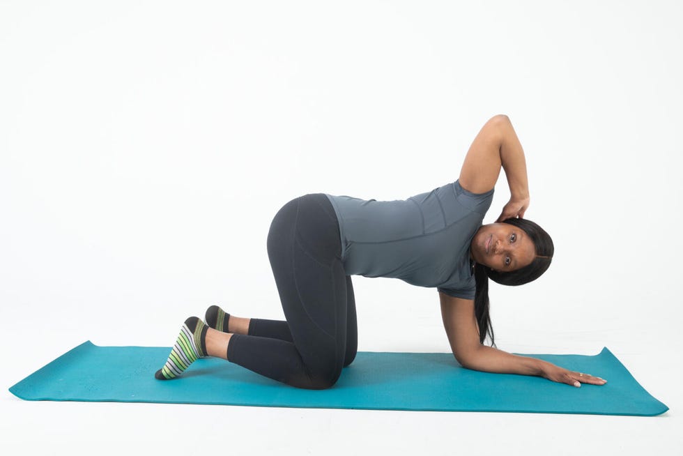 Demonstration of a stretching exercise on a yoga mat demonstration of a stretching exercise on a yoga mat