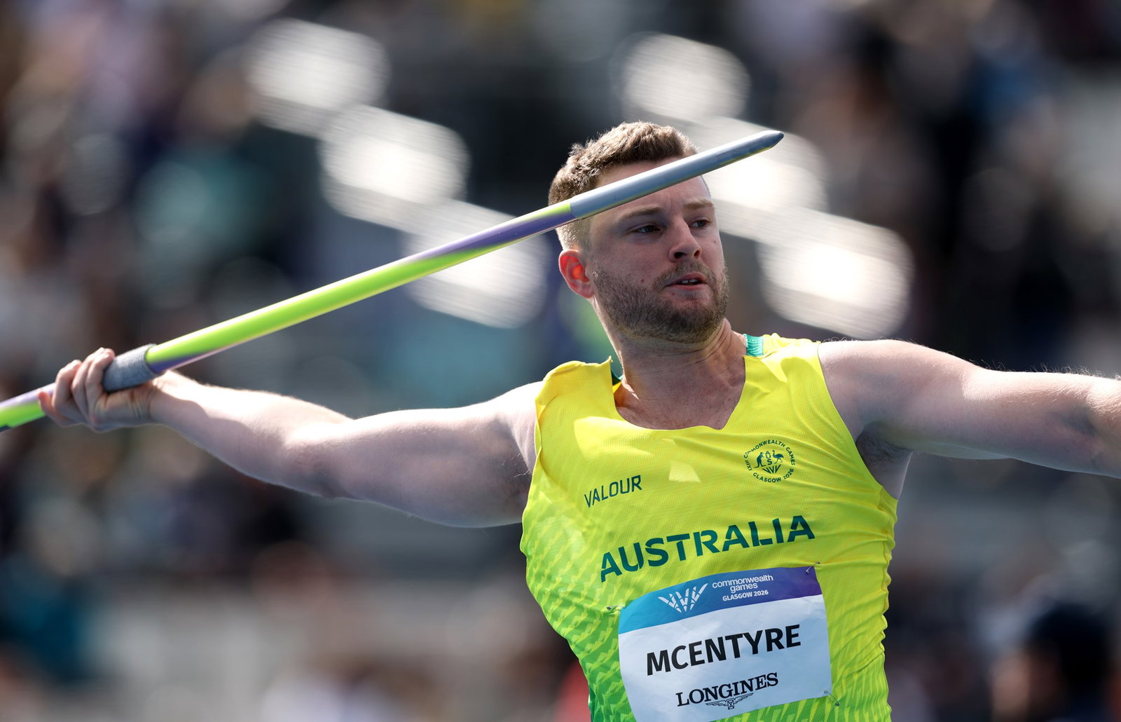 An Australian athlete throwing a javelin.