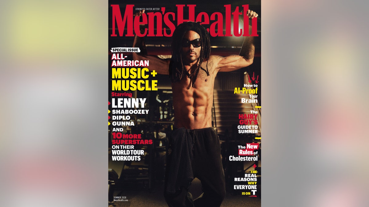 Lenny Kravitz poses shirtless with raised arms in a gym for a Men's Health magazine cover.