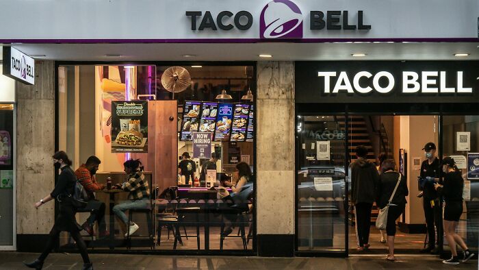 A Taco Bell restaurant with customers and staff, symbolizing the unexpected situations ER staff might encounter with ridiculous patients.