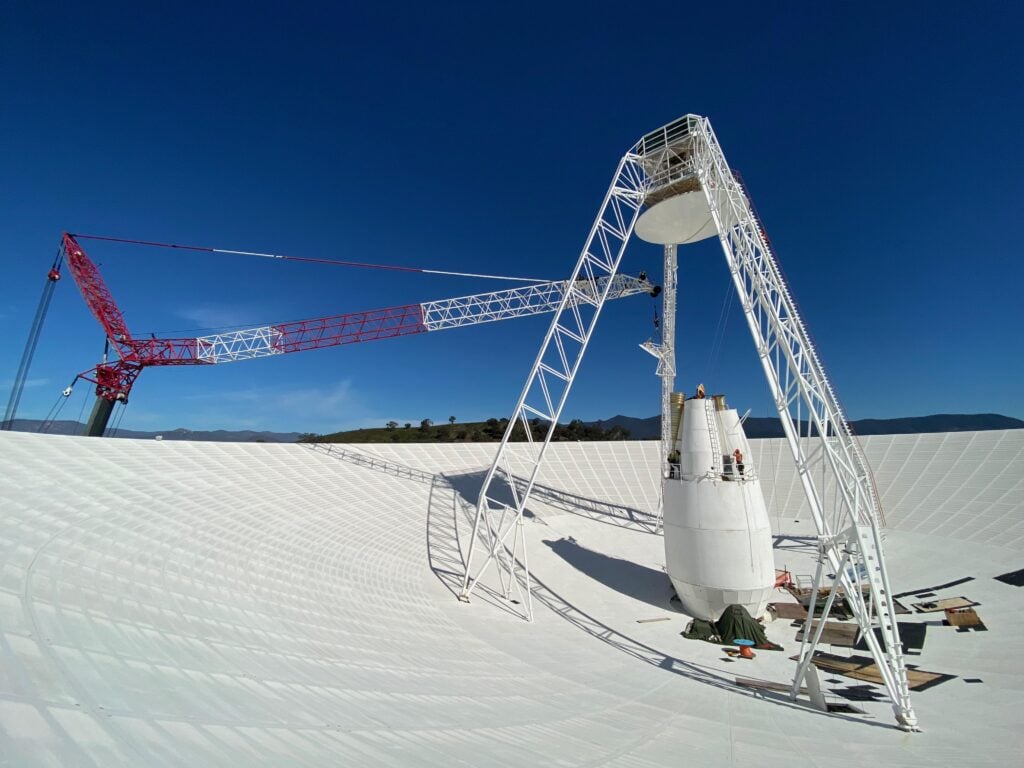 Voyager 2 flew so far below the plane of the solar system after Neptune that only one antenna on Earth can still send it commands, a 70-metre dish outside Canberra, which went offline for eleven months of repairs in 2020 while the spacecraft flew on in silence, unable to be told anything.