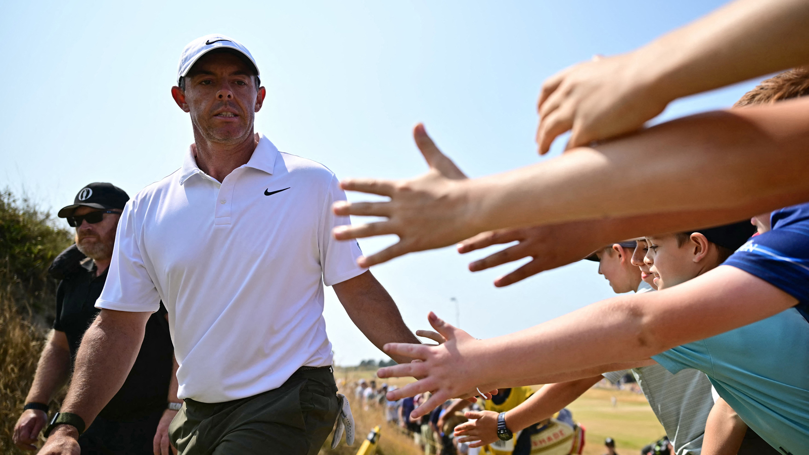 Rory McIlroy high fives fans