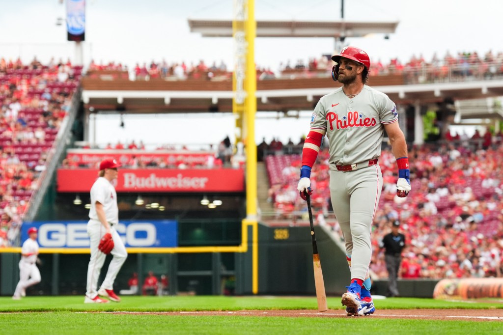 Philadelphia Phillies first baseman Bryce Harper walks to the dugout after striking out.