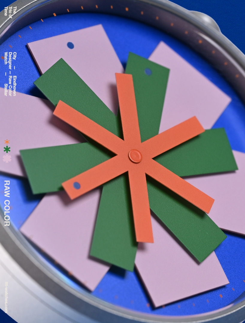 kinetic watch dial reimagines timekeeping through layered colored star-like hands - 2