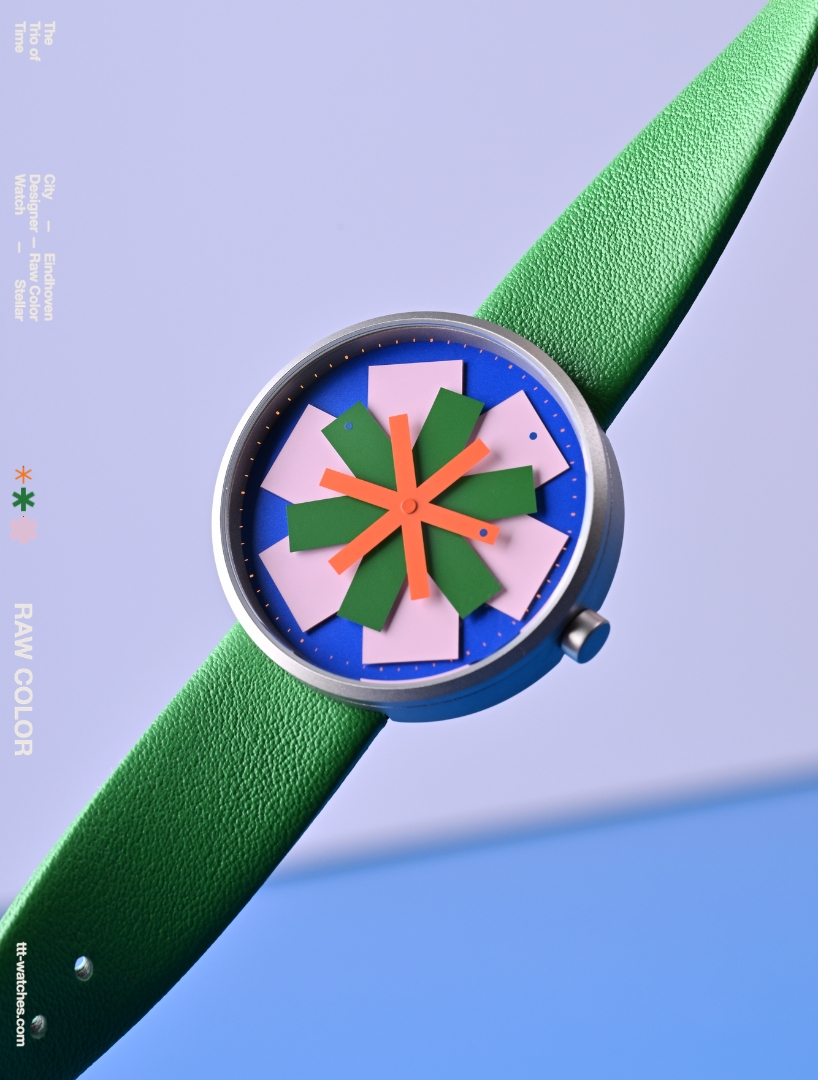 kinetic watch dial reimagines timekeeping through layered colored star-like hands - 1