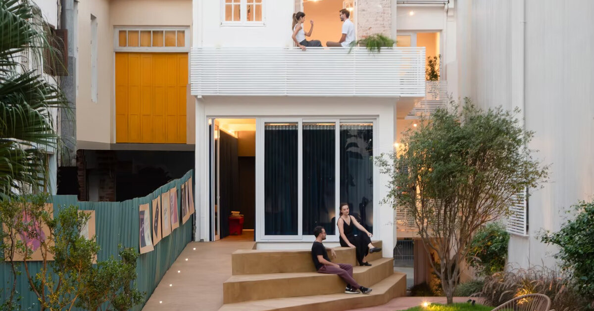 exposed brick and blue metal transform a 1930s brazilian house into a cultural art hub
