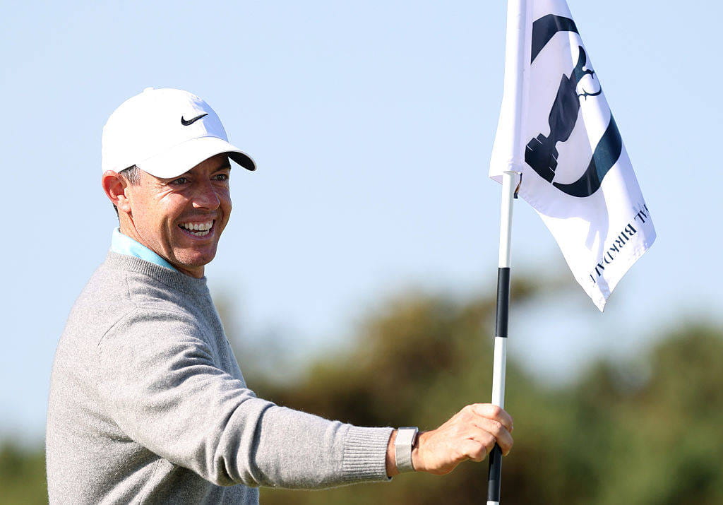 Rory McIlroy holds a flag during his practice round at Royal Birkdale