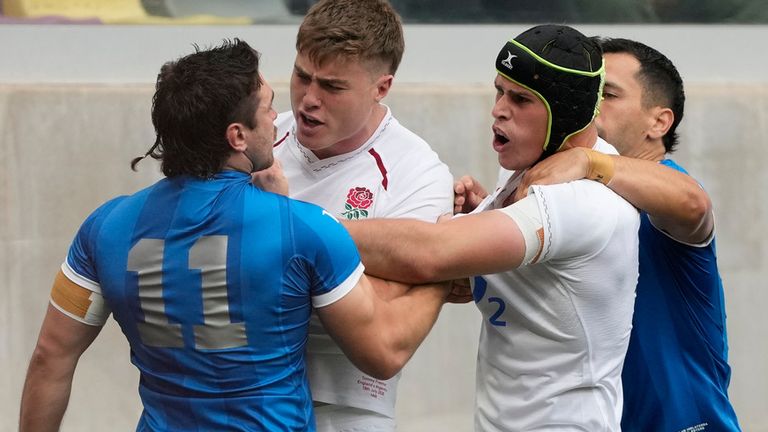 England's Tommy Freeman, center, argues with Argentina's Mateo Carreras (11) during a Nations Championship rugby match in Santiago Del Estero, Argentina, Saturday, July 18, 2026. (AP Photo/Gustavo Garello)