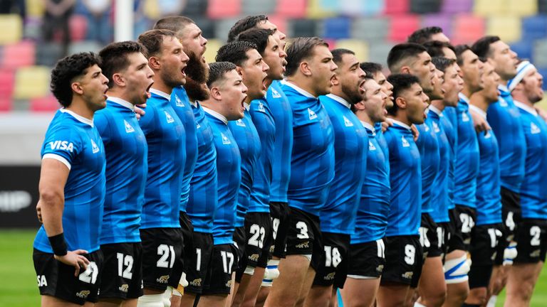 Argentina players sing the national anthem while wearing a commemorative jersey inspired by the one worn by Argentina during its 1986 World Cup quarterfinal victory over England, before a Nations Championship rugby match between Argentina and England in Santiago del Estero, Argentina, Saturday, July 18, 2026. (AP Photo/Gustavo Garello)