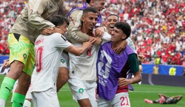 Morocco's Azzedine Ounahi is mobbed by team-mates after scoring second goal against Canada (AP Photo/David J. Phillip)