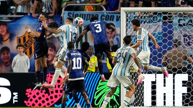 Cape Verde's Diney Borges (3) goes up against Argentina's Cristian Romero (13) and scores an own goal during the World Cup match in Miami
