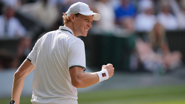 Jannik Sinner of Italy celebrates a point against Novak Djokovic of Serbia