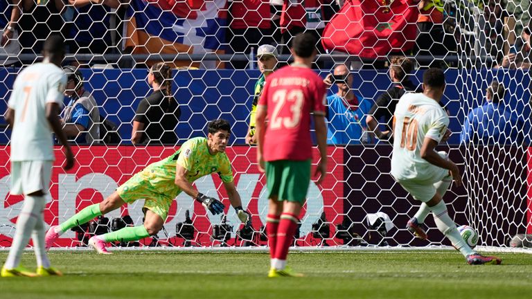Morocco goalkeeper Yassine Bounou dives to stop a penalty shot by France's Kylian Mbappe, right, during the World Cup quarterfinal soccer match between France and Morocco in Foxborough, Mass., near Boston, Thursday, July 9, 2026. (AP Photo/Matt Slocum)