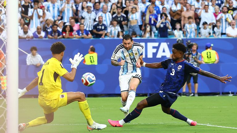 Lionel Messi scores the opening goal for Argentina against Cape Verde at the World Cup