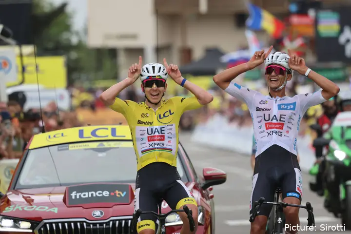 Tadej Pogacar and Isaac del Toro celebrate on Alpe d’Huez after the Tour de France podium.