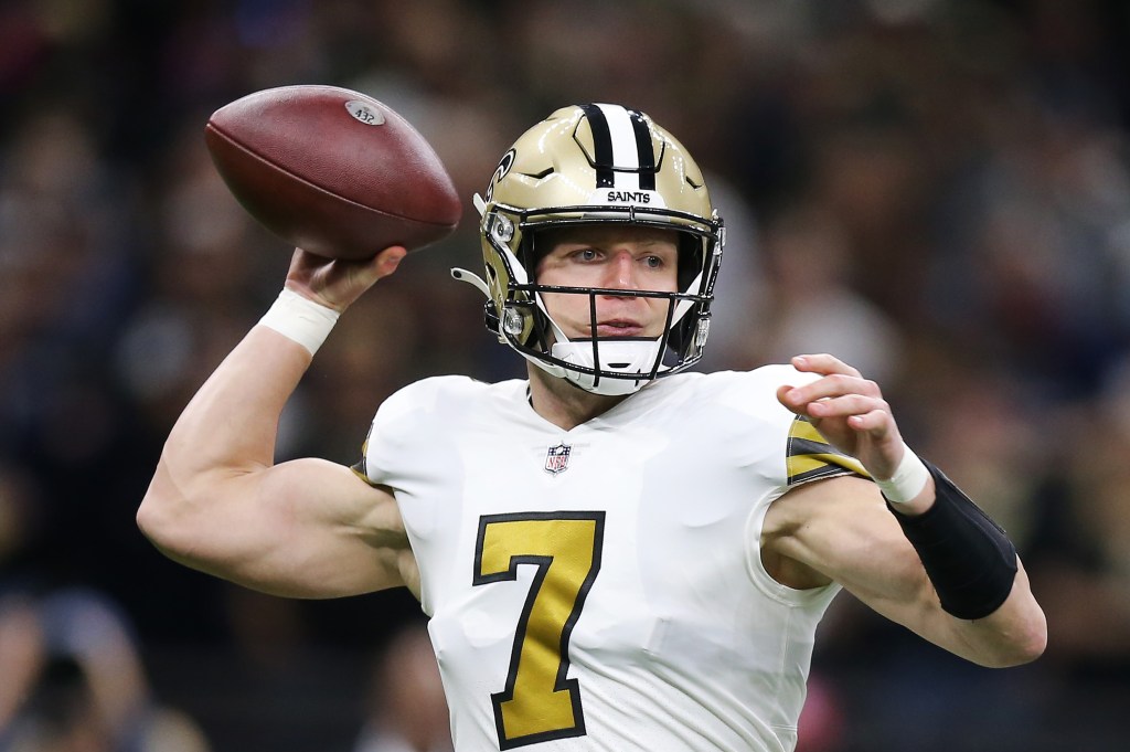 Taysom Hill of the New Orleans Saints looks to throw the ball from the pocket.