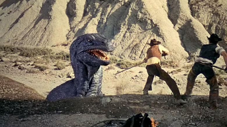 Cowboys capturing a dinosaur in 