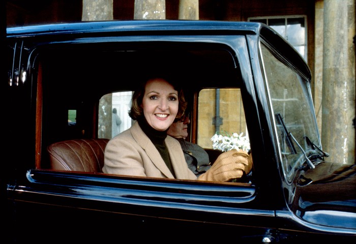 Penelope Keith as Audrey fforbes-Hamilton in To the Manor Born Penelope Keith as Audrey fforbes-Hamilton in To the Manor Born, sitting in a car, holding the steering wheel and smiling at the camera.