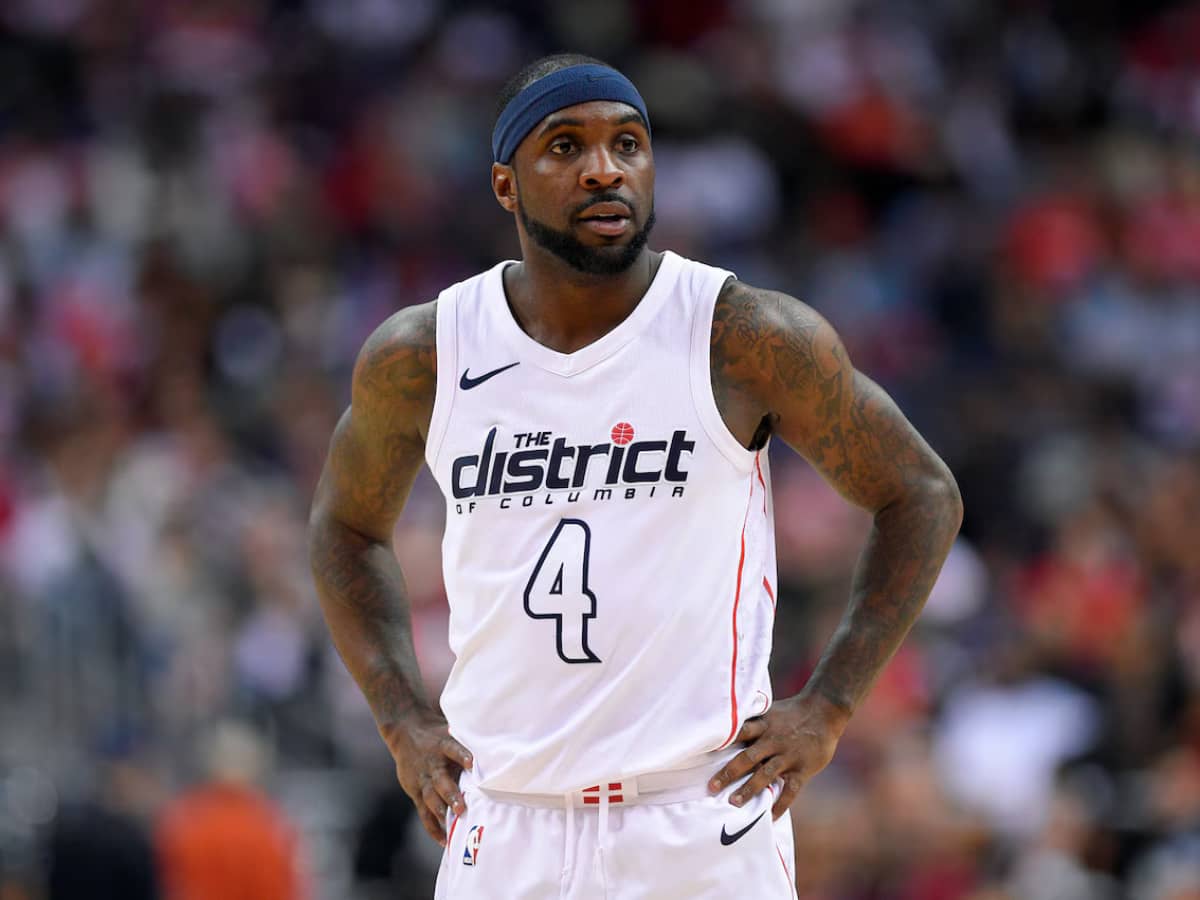 Washington Wizards guard Ty Lawson (4) looks on during the second half of Game 4 of an NBA basketball first-round playoff series against the Toronto Raptors, in Washington. Less than three weeks ago, Lawson was playing professional basketball in China. Nowadays, he's been one of the first subs off the bench for the Washington Wizards in their Eastern Conference first-round playoff series against the No. 1 seed Toronto Raptors (AP Photo/Nick Wass, File)