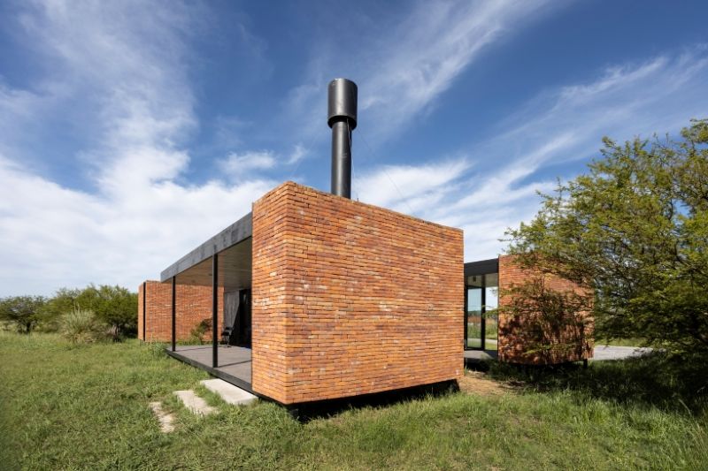 monolithic brick volumes wrap weekend house around a series of courtyards in argentina - 4
