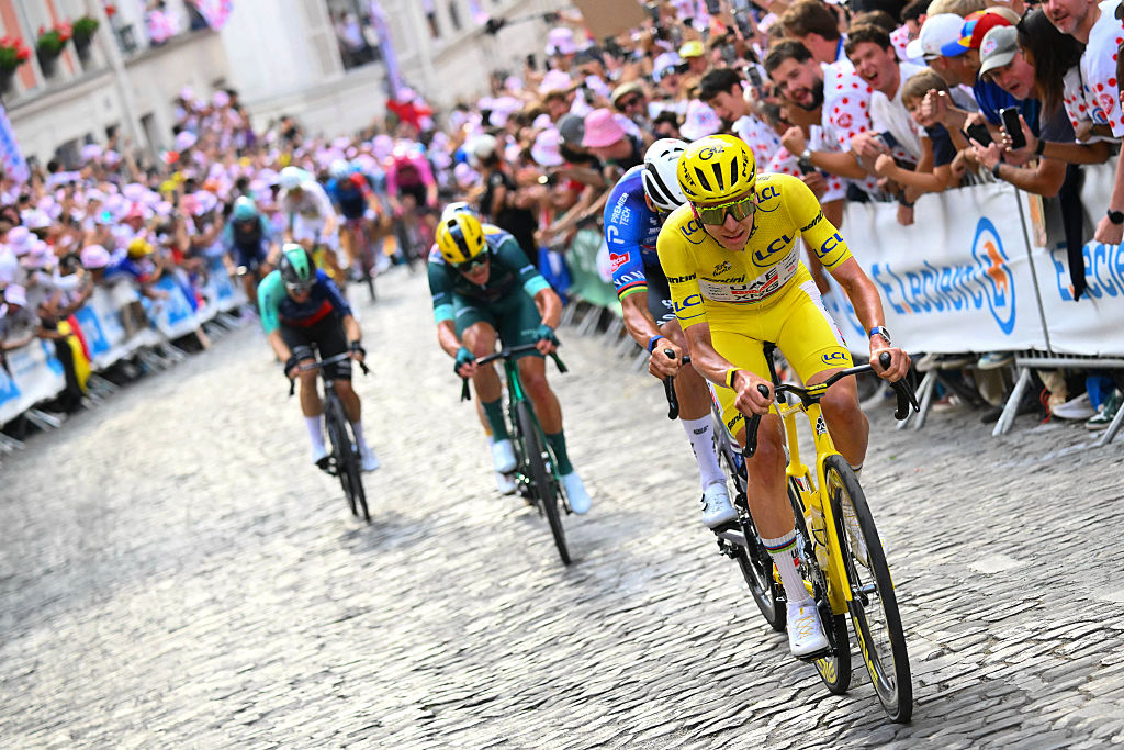 UAE Team Emirates - XRG's Slovenian rider Tadej Pogacar wearing the overall leader's yellow jersey cycles on the Butte de Montmartre during the 21st stage of the 113th edition of the Tour de France cycling race, 88,7 km starting and finishing in Paris, on July 26, 2026. (Photo by Etienne GARNIER / POOL / AFP)