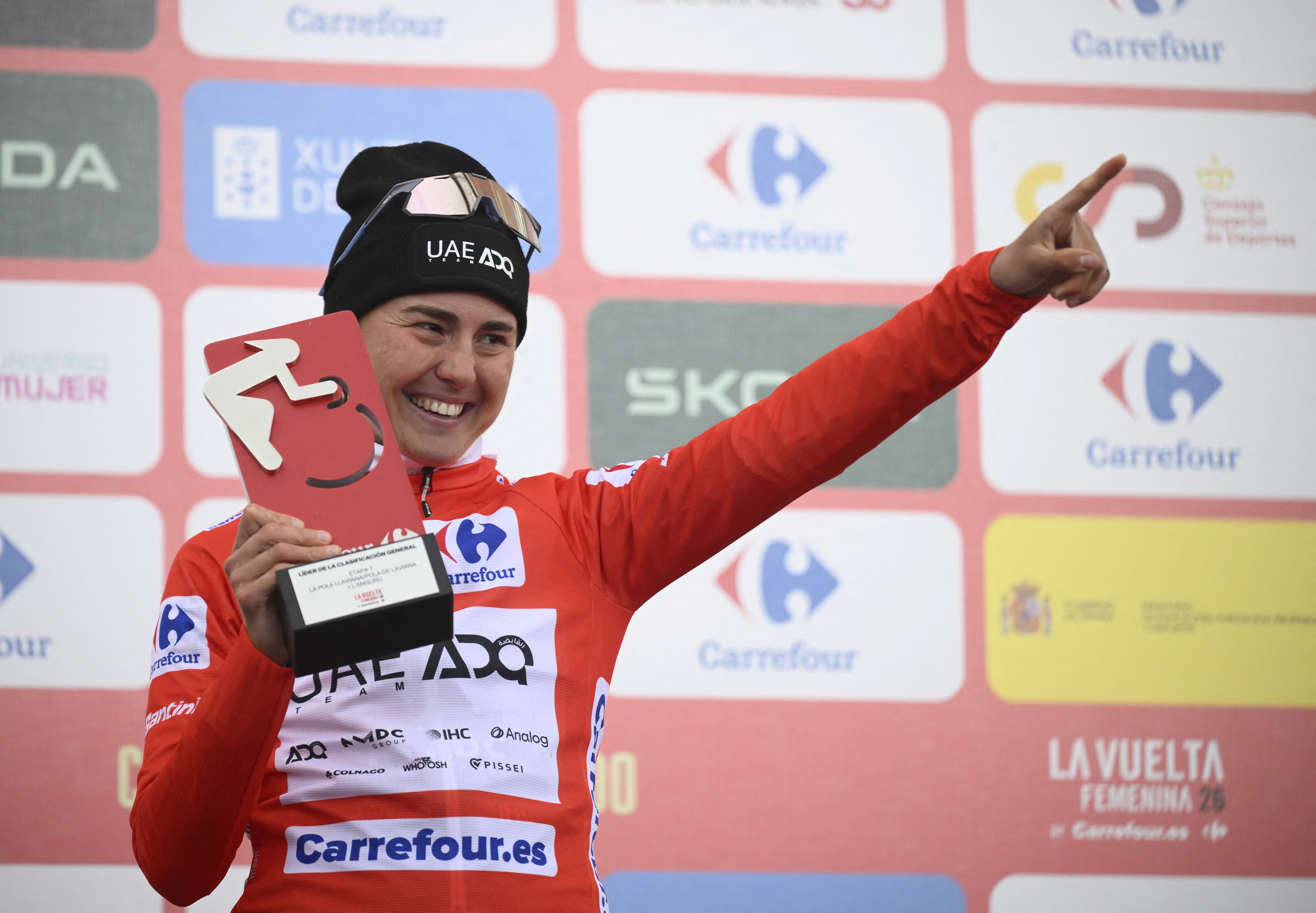 Winner of 2026 La Vuelta Femenina team UAE ADQ's Spanish rider Paula Blasi celebrates on the podium on Alto de l'Angliru (Photo by Miguel RIOPA / AFP)