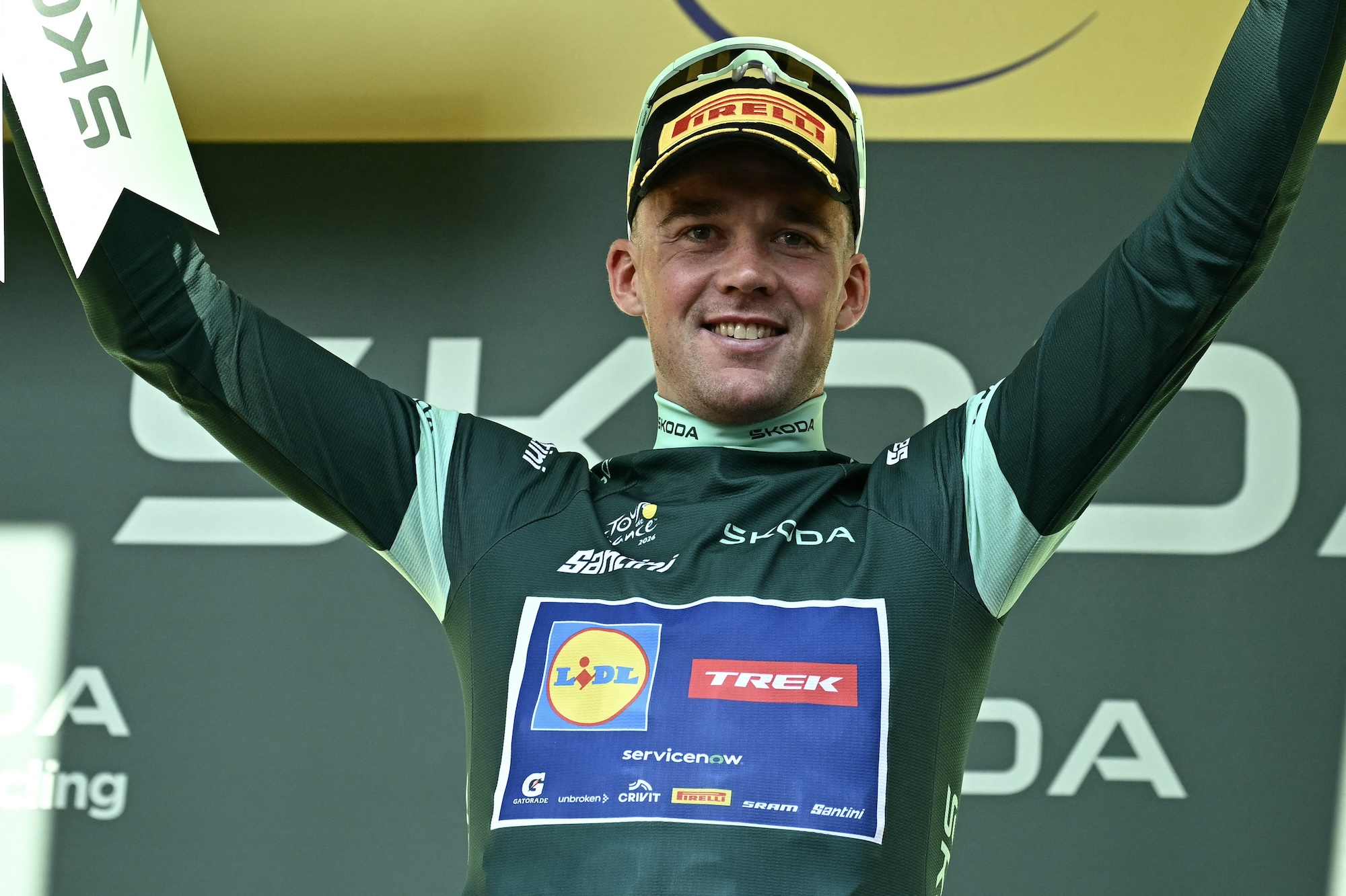 Lidl - Trek team's Danish rider Mads Pedersen celebrates on the podium with the best sprinter's green jersey after the 17th stage of the 113th edition of the Tour de France cycling race, 174,7 km between Chamb&eacute;ry and Voiron in the French Alps, on July 22, 2026. (Photo by Loic VENANCE / AFP)