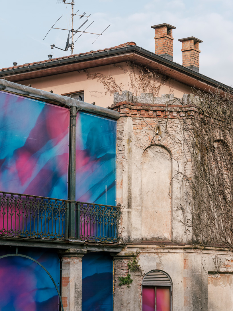 colorful printed textile installation reimagines historic laundry building facade in switzerland - 5