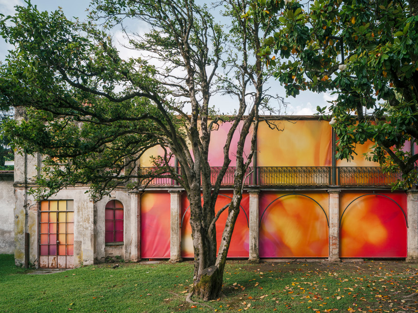 colorful printed textile installation reimagines historic laundry building facade in switzerland - 2
