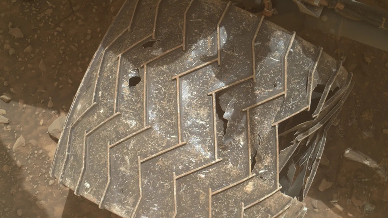 Close-up of Curiosity's wheel showing breaks and tears