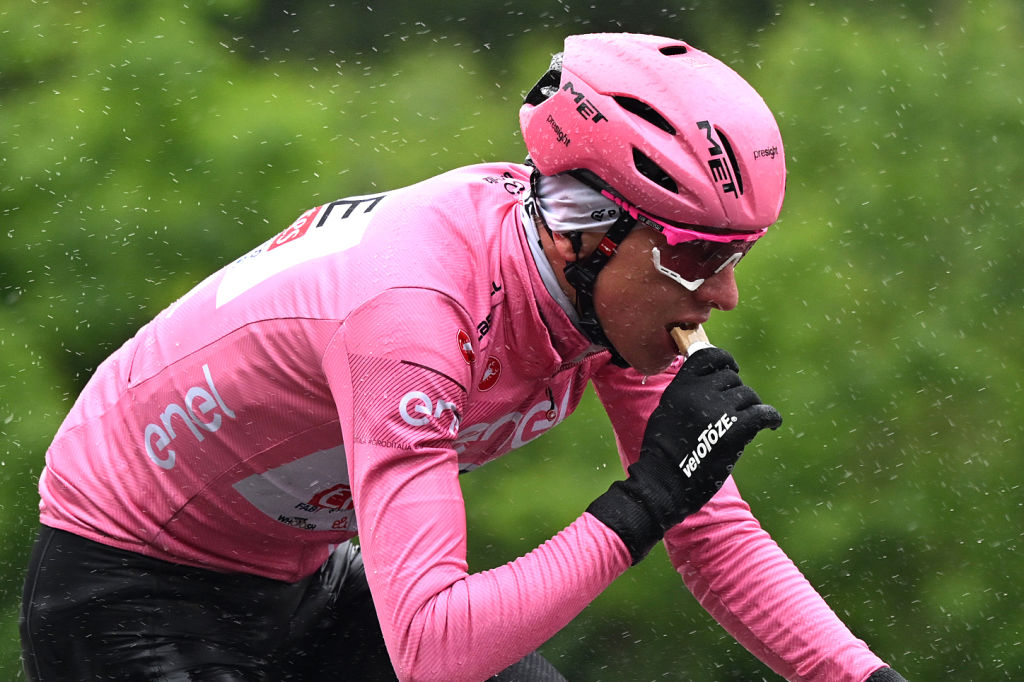 SANTA CRISTINA VALGARDENA - MONTE PANA, ITALY - MAY 21: (EDITOR&amp;apos;S NOTE: Alternate crop) Tadej Pogacar of Slovenia and UAE Team Emirates - Pink Leader Jersey rides whilst eating during the 107th Giro d&amp;apos;Italia 2024, Stage 16 a 118.7km stage from Lasa - Laas to Santa Cristina Valgardena - Monte Pana 1625m / Route and stage modified due to adverse weather conditions / #UCIWT / on May 21, 2024 in Santa Cristina Valgardena - Monte Pana, Italy. (Photo by Tim de Waele/Getty Images)