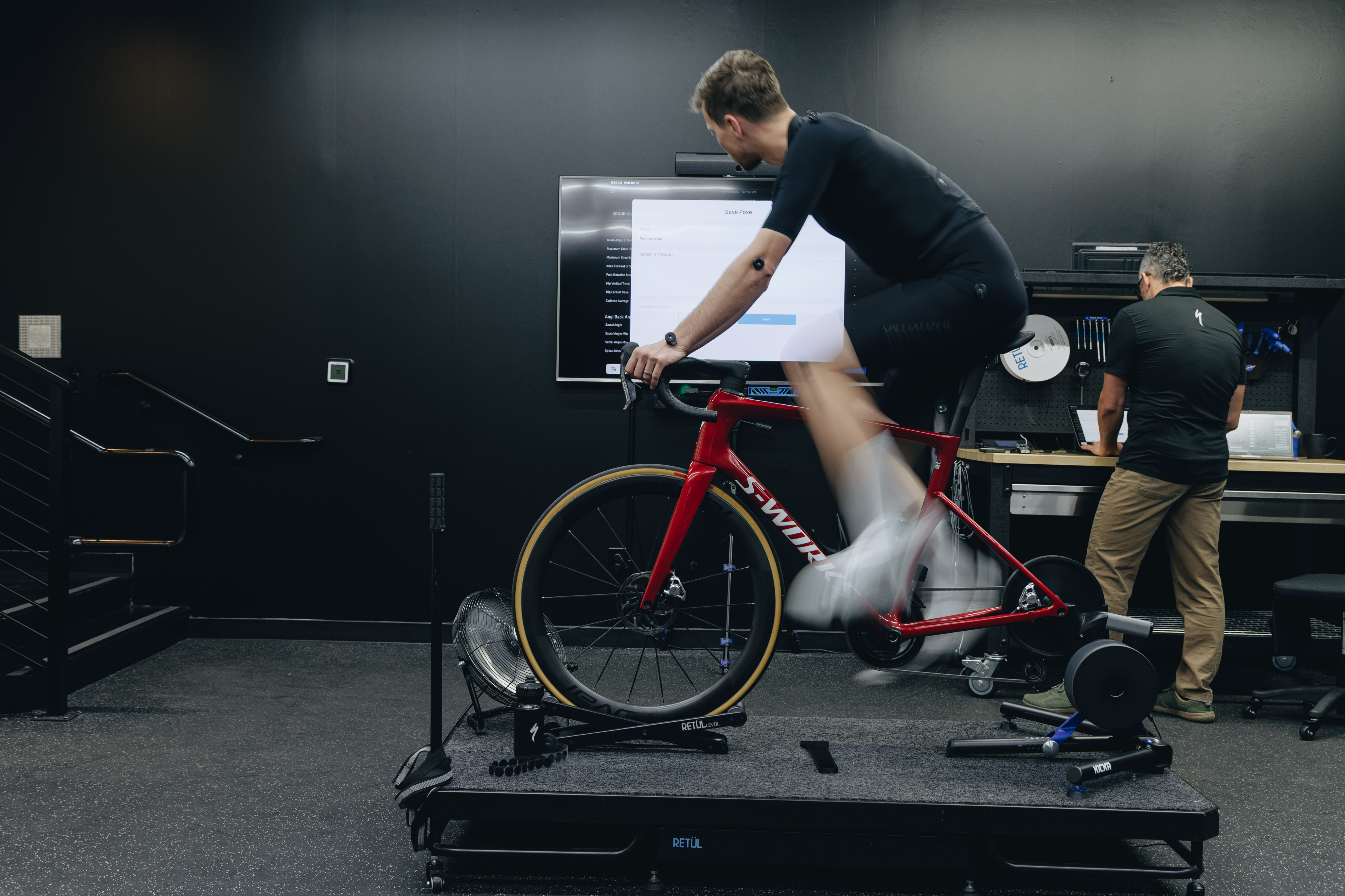 Jason Williams giving a bike fit to Josh Croxton