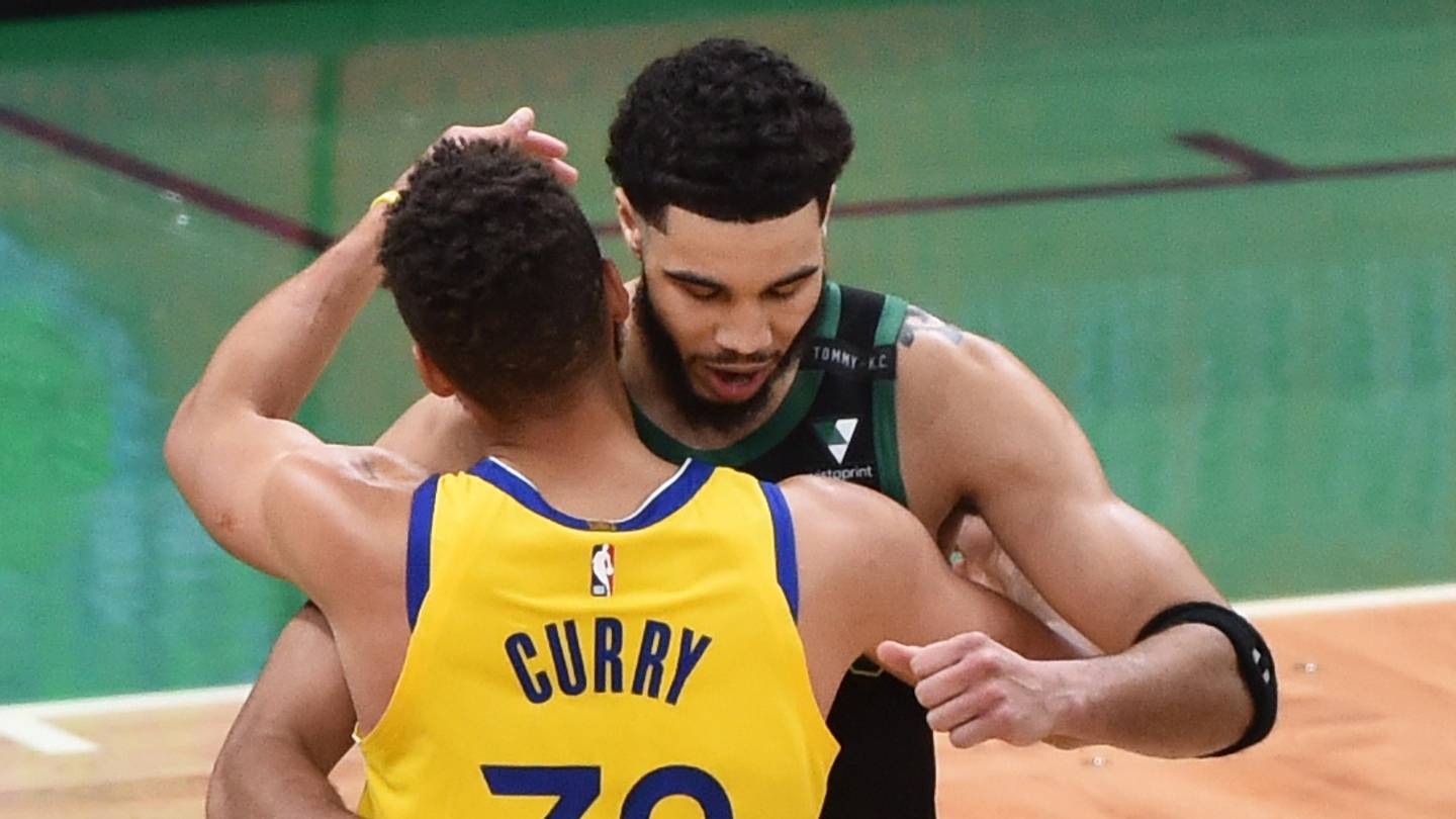 Apr 17, 2021; Boston, Massachusetts, USA;  Golden State Warriors guard Stephen Curry (30) and Boston Celtics forward Jayson Tatum (0) embrace after the game at TD Garden. Mandatory Credit: Bob DeChiara-USA TODAY Sports