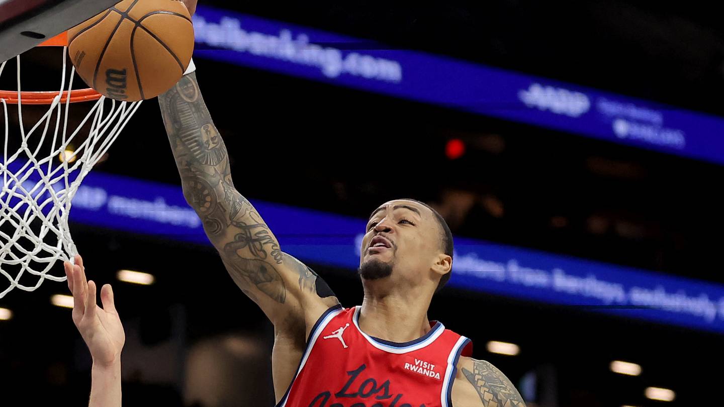 Jan 9, 2026; Brooklyn, New York, USA; Los Angeles Clippers forward John Collins (20) blocks a shot by Brooklyn Nets forward Michael Porter Jr. (17) during the third quarter at Barclays Center. Mandatory Credit: Brad Penner-Imagn Images