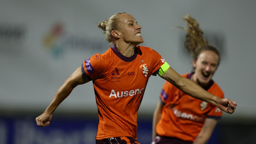 Tameka Yallop celebrates a goal for Brisbane Roar in ALW