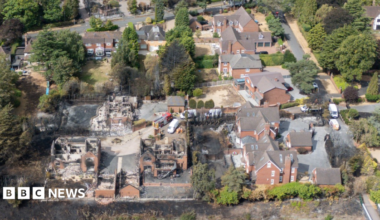 An aerial view of houses damaged by fire with a number of properties largely destroyed