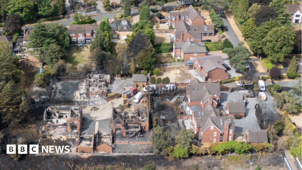 An aerial view of houses damaged by fire with a number of properties largely destroyed