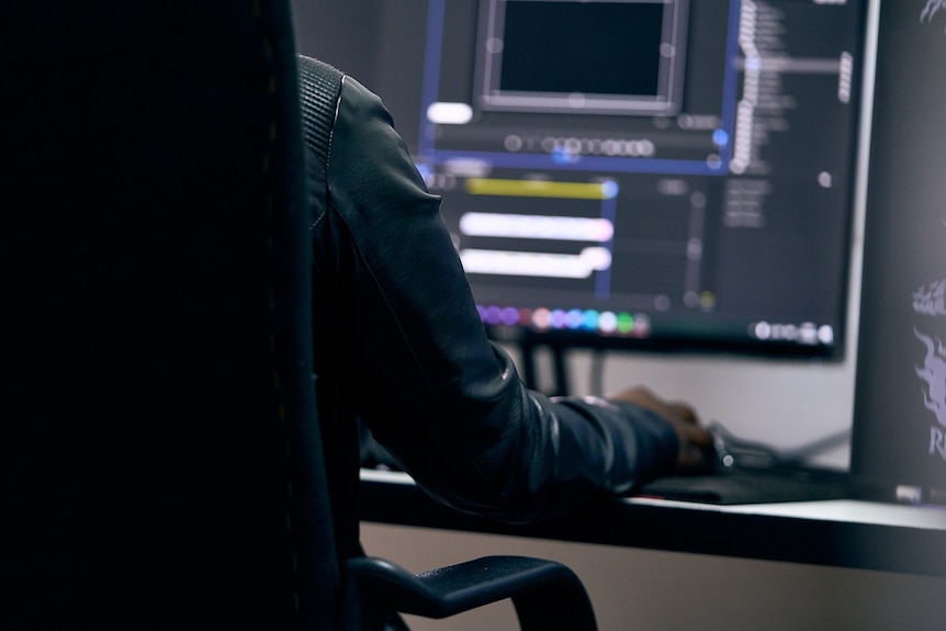 a man sitting at a computer