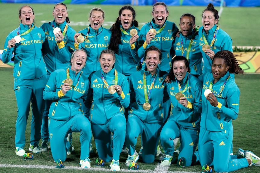 The Australian women's rugby sevens team celebrates with their Rio gold medals.