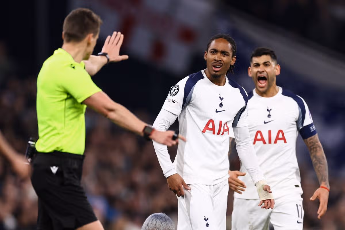 Djed Spence and Cristian Romero of Tottenham Hotspur