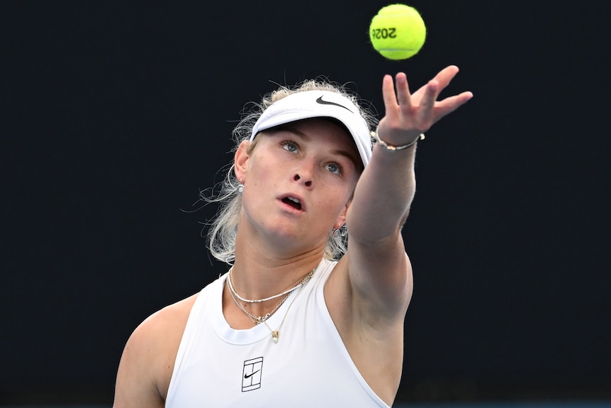 Emerson Jones serves at Brisbane International.