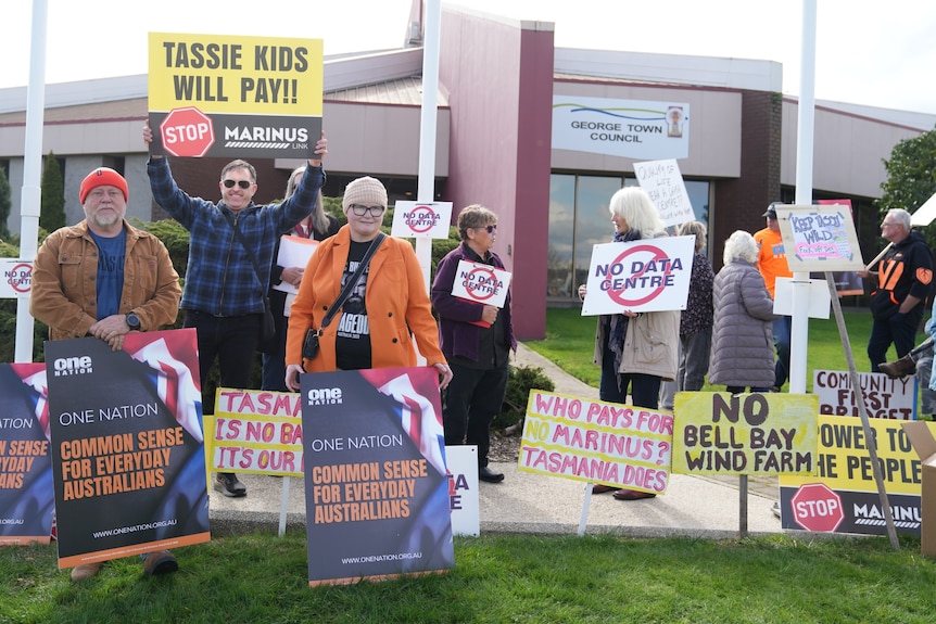 Anti-data centre protesters with placards.