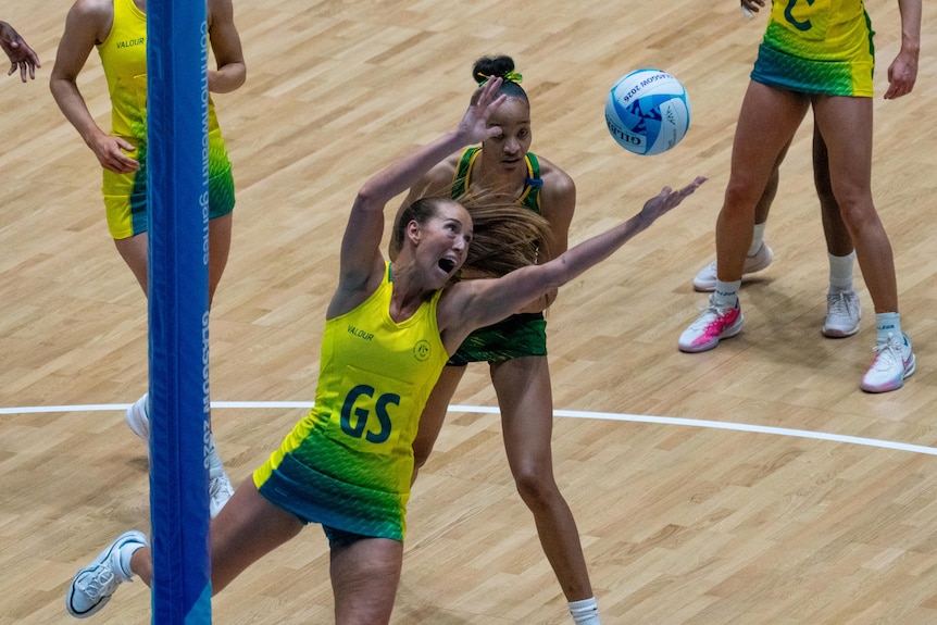 Cara Koenen reaches for the ball during the Australia's netball semifinal against Jamaica at the Commonwealth Games.