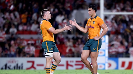 Isaac Henry and Joseph-Aukuso Suaalii celebrate a win.