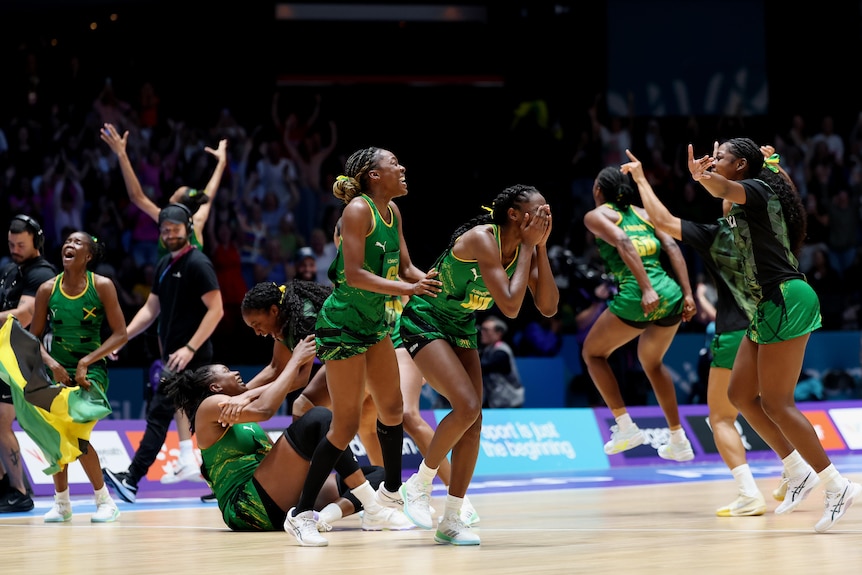 Jamaican players react to beating the Diamonds in their Glasgow Commonwealth Games netball semifinal.