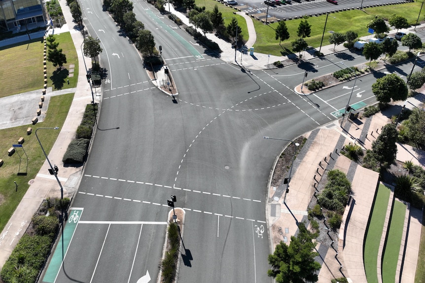 A view from above showing an intersection on a road which has no traffic on it.